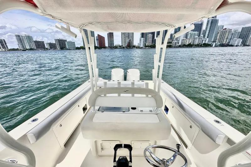 Why Knot Yacht Photos Pics 2014 Sailfish 320 CC boat interior with city skyline in the background.