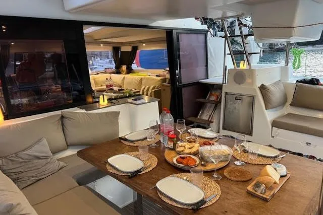 Sanouva Yacht Photos Pics Luxurious 2019 Fountaine Pajot SABA 50 yacht interior with elegant dining setup.