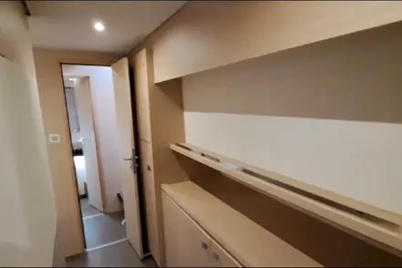 Sanouva Yacht Photos Pics Interior hallway of 2019 Fountaine Pajot SABA 50 catamaran, featuring modern wood finishes.