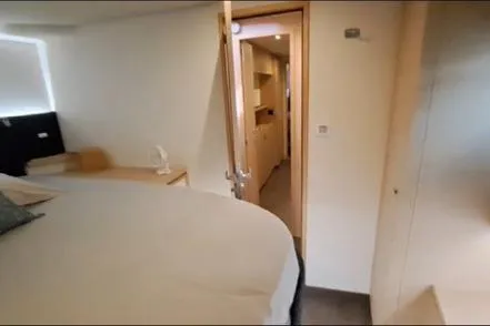 Sanouva Yacht Photos Pics Interior cabin of 2019 Fountaine Pajot SABA 50 catamaran, featuring modern design and cozy furnishings.