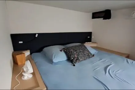 Sanouva Yacht Photos Pics 2019 Fountaine Pajot SABA 50 cabin with a cozy bed and modern decor.