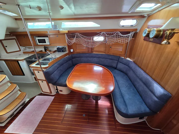  Yacht Photos Pics Interior of 2000 Catalina 42 MkII sailboat with dining area and kitchen.