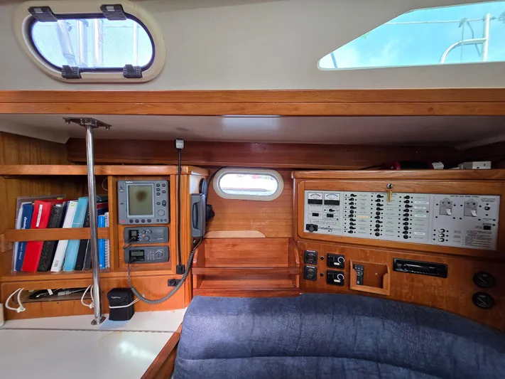  Yacht Photos Pics Interior of a 2000 Catalina 42 MkII sailboat with navigation equipment and control panels.