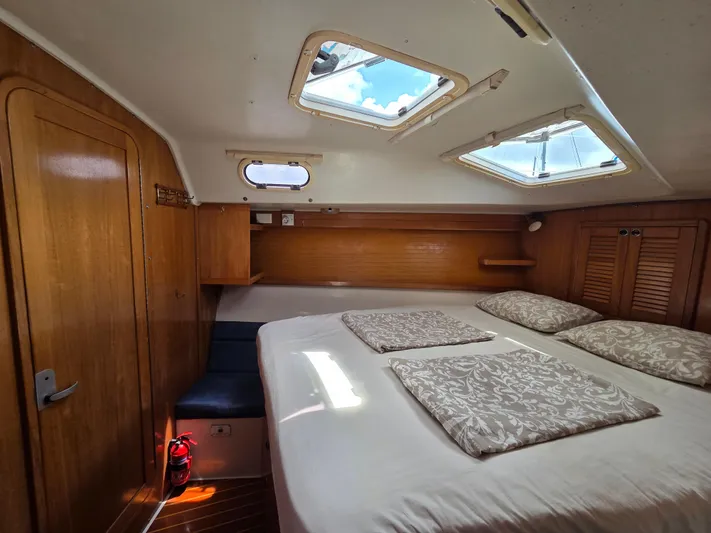  Yacht Photos Pics Cozy cabin interior of 2000 Catalina 42 MkII sailboat with skylights and wooden finishes.