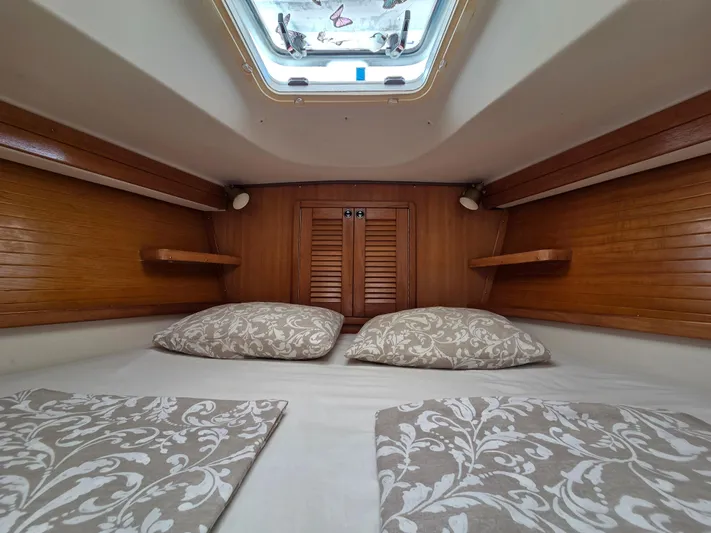  Yacht Photos Pics Cozy cabin interior of 2000 Catalina 42 MkII sailboat with patterned bedding.