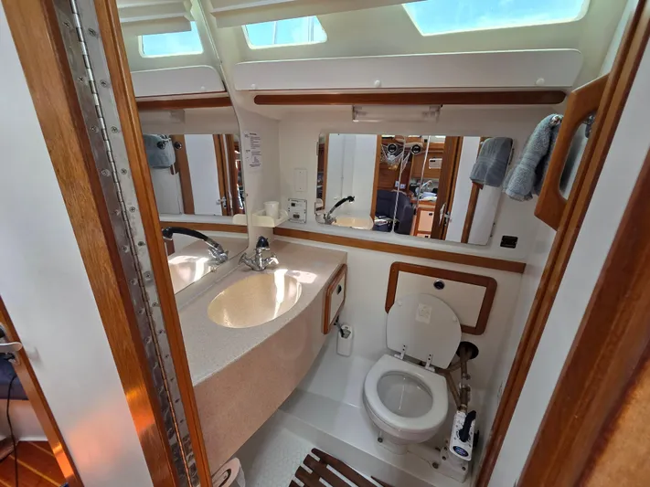  Yacht Photos Pics Bathroom interior of a 2000 Catalina 42 MkII sailboat, featuring sink and toilet.