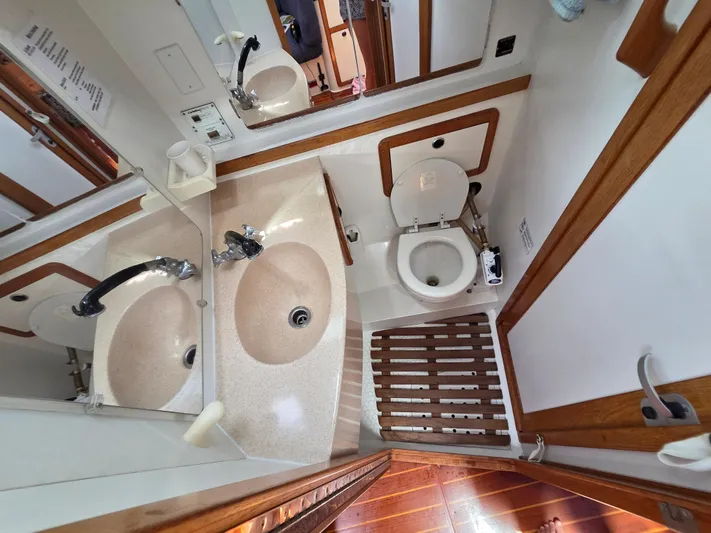  Yacht Photos Pics Bathroom interior of a 2000 Catalina 42 MkII yacht with sink and toilet.