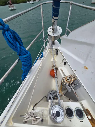  Yacht Photos Pics Bow of a 2000 Catalina 42 MkII sailboat with anchor chain and blue rope.