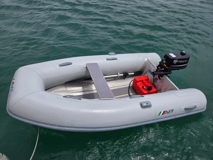  Yacht Photos Pics Inflatable dinghy with Tohatsu outboard motor on water, Catalina 42 MkII, 2000 model.