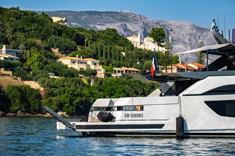 M8-15 Yacht Photos Pics Luxury Bluegame BGX 63 yacht cruising near scenic coastal villas, 2023 model.