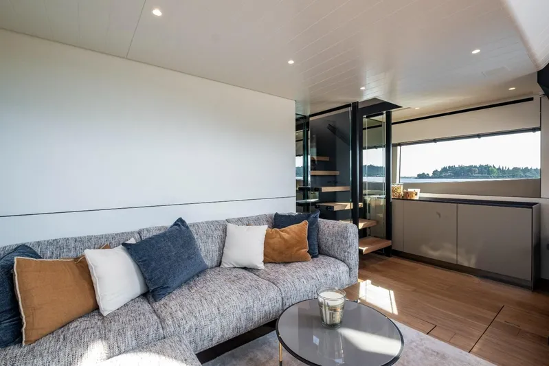 M8-15 Yacht Photos Pics Luxurious interior of 2023 Bluegame BGX 63 yacht with modern sofa and elegant decor.