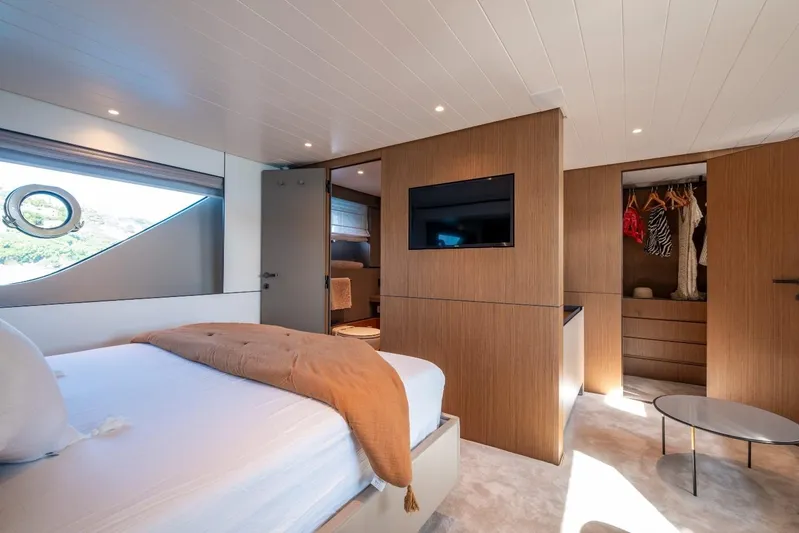 M8-15 Yacht Photos Pics Luxurious interior of 2023 Bluegame BGX 63 yacht with modern bedroom and closet.