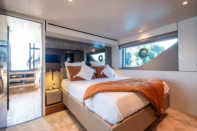 M8-15 Yacht Photos Pics Luxurious bedroom interior of 2023 Bluegame BGX 63 yacht with modern design and large windows.