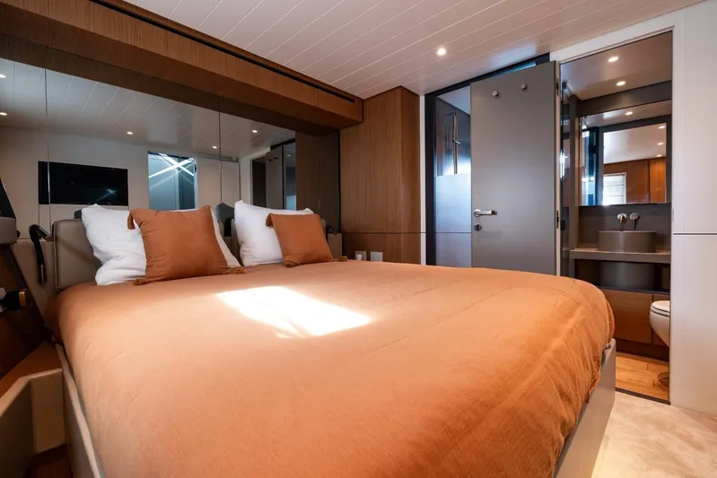 M8-15 Yacht Photos Pics Luxurious bedroom interior of 2023 Bluegame BGX 63 yacht with modern design and ensuite bathroom.