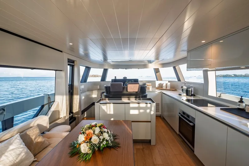 M8-15 Yacht Photos Pics Luxurious interior of 2023 Bluegame BGX 63 yacht with modern kitchen and ocean view.