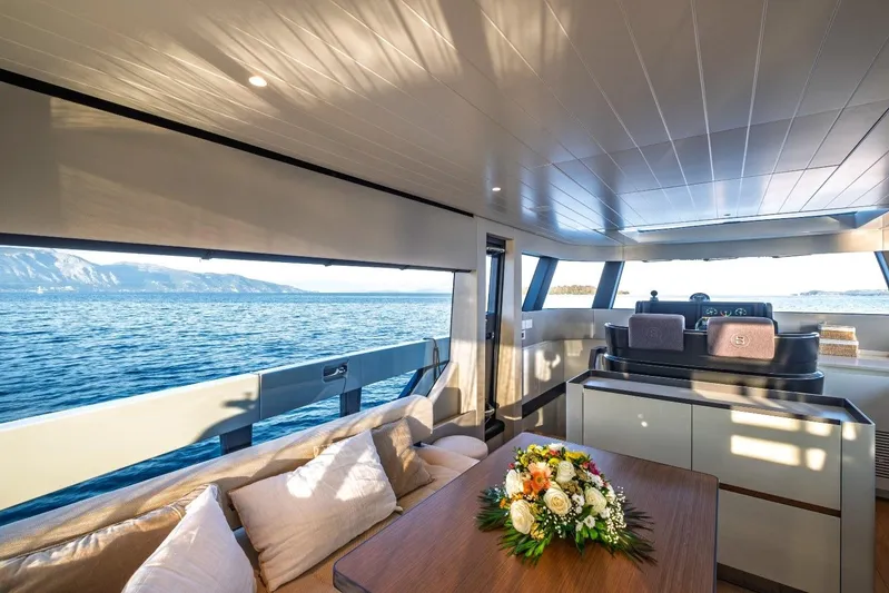 M8-15 Yacht Photos Pics Luxurious interior of 2023 Bluegame BGX 63 yacht with ocean view and elegant decor.