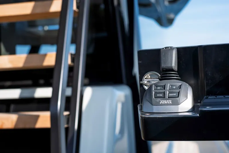 M8-15 Yacht Photos Pics Control panel on 2023 Bluegame BGX 63 yacht with wooden steps in background.