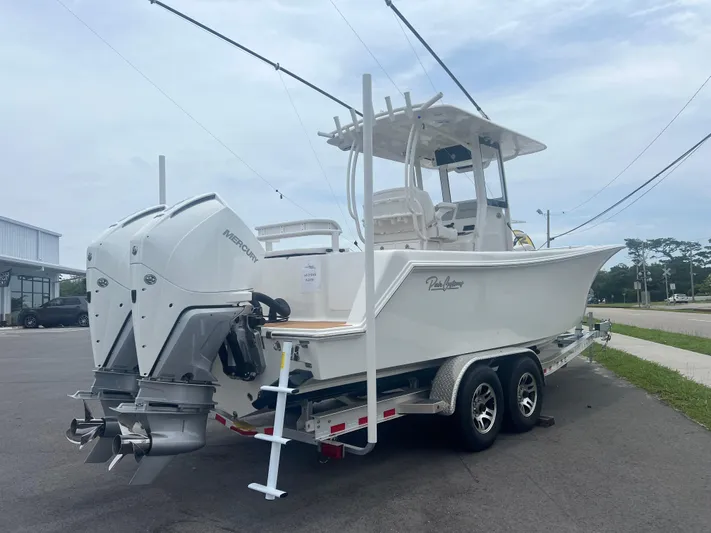  Yacht Photos Pics 2025 Pair Customs 28 Center Console boat on trailer, featuring dual outboard engines.