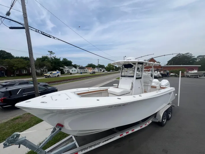  Yacht Photos Pics 2025 Pair Customs 28 Center Console boat on trailer, parked on street.