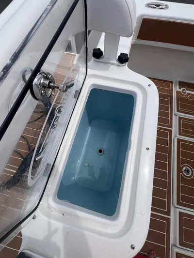  Yacht Photos Pics 2025 Pair Customs 28 Center Console boat with open storage compartment.