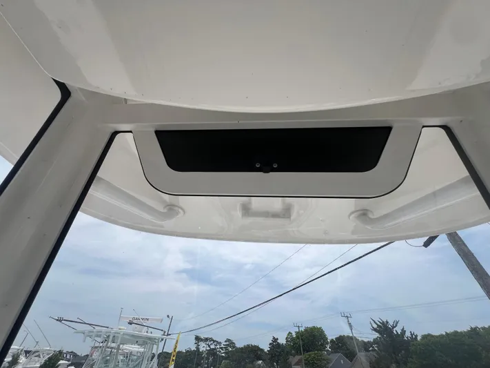  Yacht Photos Pics 2025 Pair Customs 28 Center Console boat roof view with clear sky background.