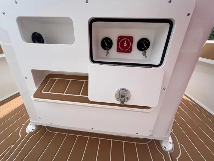  Yacht Photos Pics 2025 Pair Customs 28 Center Console boat dashboard with controls and storage compartments.