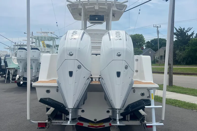  Yacht Photos Pics 2025 Pair Customs 28 Center Console with dual outboard engines, rear view.