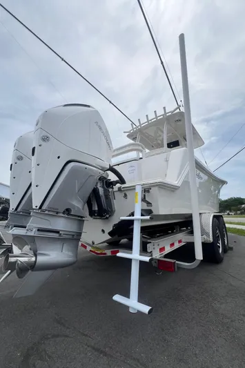  Yacht Photos Pics 2025 Pair Customs 28 Center Console boat on trailer, featuring powerful outboard motor.
