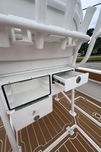  Yacht Photos Pics 2025 Pair Customs 28 Center Console boat interior with storage compartments and rod holders.