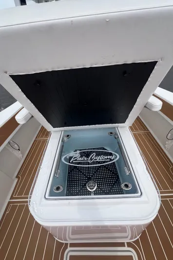  Yacht Photos Pics 2025 Pair Customs 28 Center Console boat with open storage compartment.