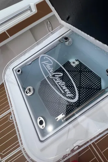  Yacht Photos Pics 2025 Pair Customs 28 Center Console boat hatch with logo and sleek design.