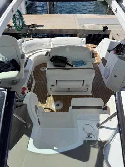  Yacht Photos Pics 2009 Cruisers Yachts 390 Sports Coupe interior with white seating and wooden flooring.