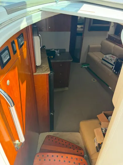  Yacht Photos Pics Interior of 2009 Cruisers Yachts 390 Sports Coupe, featuring cabin and seating area.