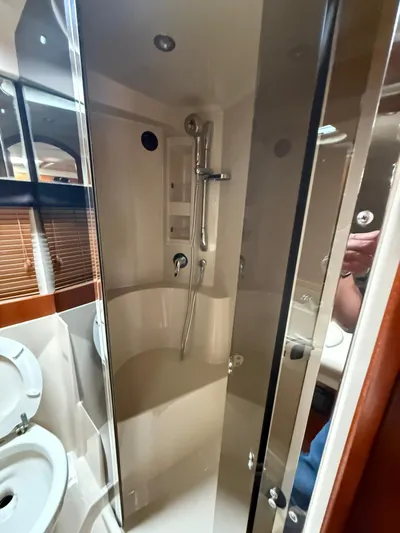  Yacht Photos Pics Bathroom interior of 2009 Cruisers Yachts 390 Sports Coupe with shower and sink.
