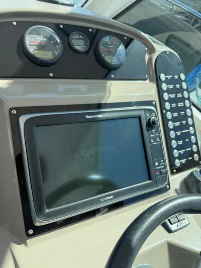  Yacht Photos Pics Dashboard of 2009 Cruisers Yachts 390 Sports Coupe with Raymarine display and gauges.