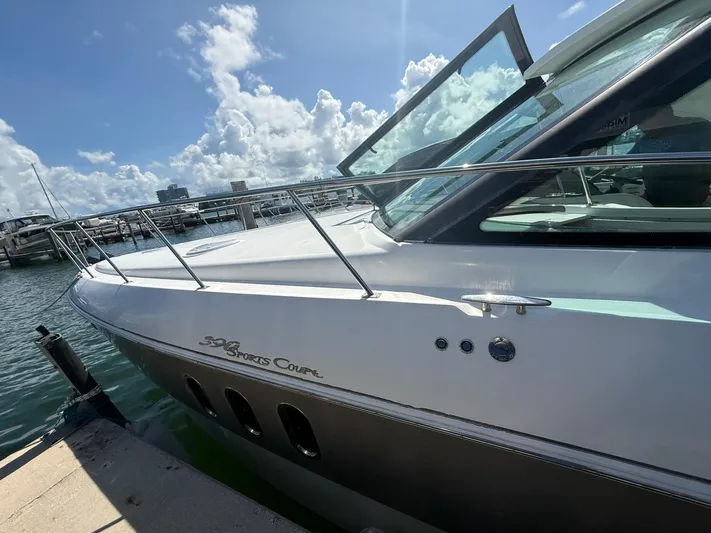  Yacht Photos Pics 2009 Cruisers Yachts 390 Sports Coupe docked under a sunny sky.