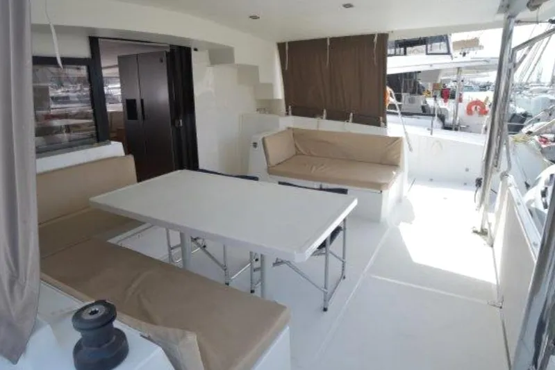  Yacht Photos Pics Spacious deck area of 2016 Bali 4.5 catamaran with seating and table.