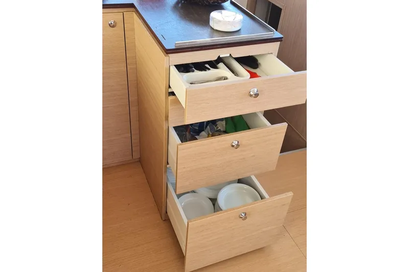  Yacht Photos Pics Wooden drawers in a Bali 4.5 yacht, 2016 model, with utensils and dishes.