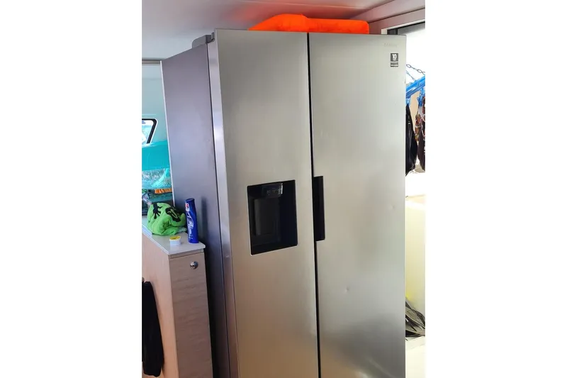  Yacht Photos Pics Stainless steel refrigerator inside a 2016 Bali 4.5 model yacht interior.