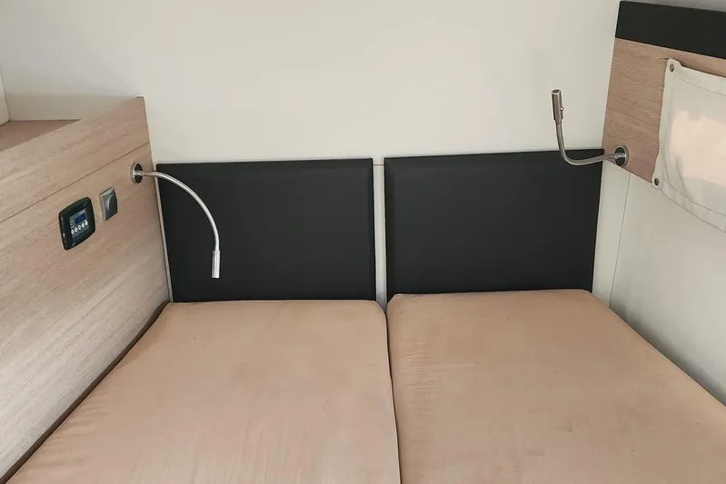  Yacht Photos Pics Interior of 2016 Bali 4.5 yacht cabin with twin beds and reading lights.