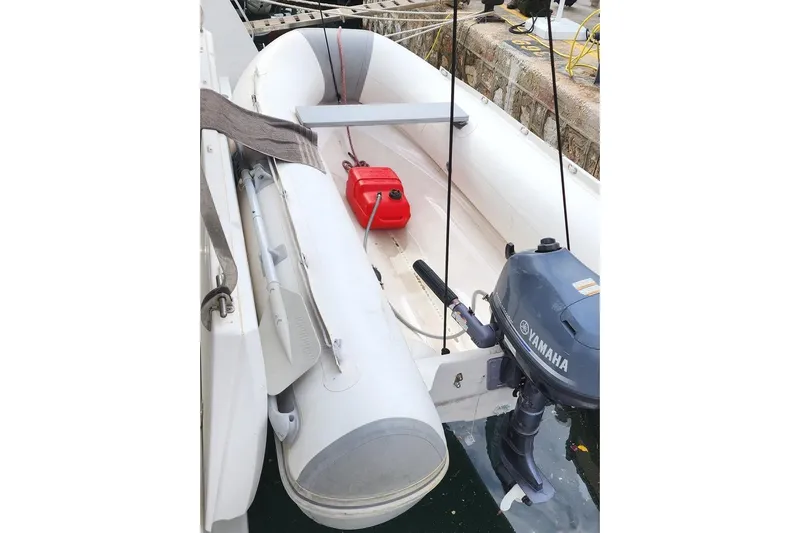  Yacht Photos Pics Inflatable Bali 4.5 boat with Yamaha motor, docked, featuring a red fuel tank.