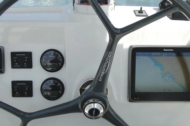  Yacht Photos Pics Steering wheel and navigation panel on 2016 Bali 4.5 yacht cockpit.