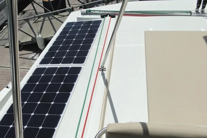  Yacht Photos Pics Solar panels on a 2016 Bali 4.5 catamaran deck, docked at a marina.