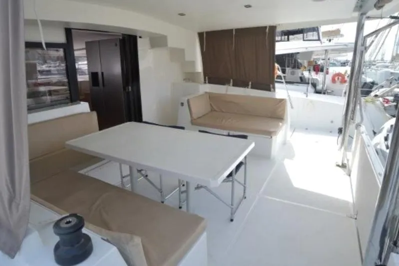  Yacht Photos Pics Spacious deck area of 2016 Bali 4.5 catamaran with seating and table.