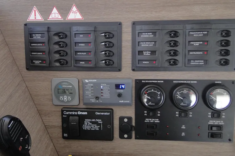  Yacht Photos Pics Control panel of a 2016 Bali 4.5 yacht with various switches and gauges.