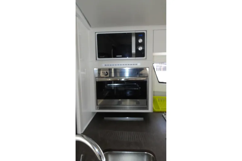  Yacht Photos Pics Modern kitchen appliances in a 2016 Bali 4.5 yacht interior.