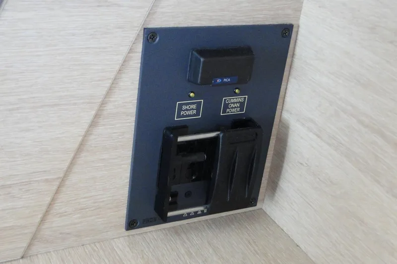  Yacht Photos Pics Power control panel in a 2016 Bali 4.5 yacht, featuring shore and Cummins Onan power options.