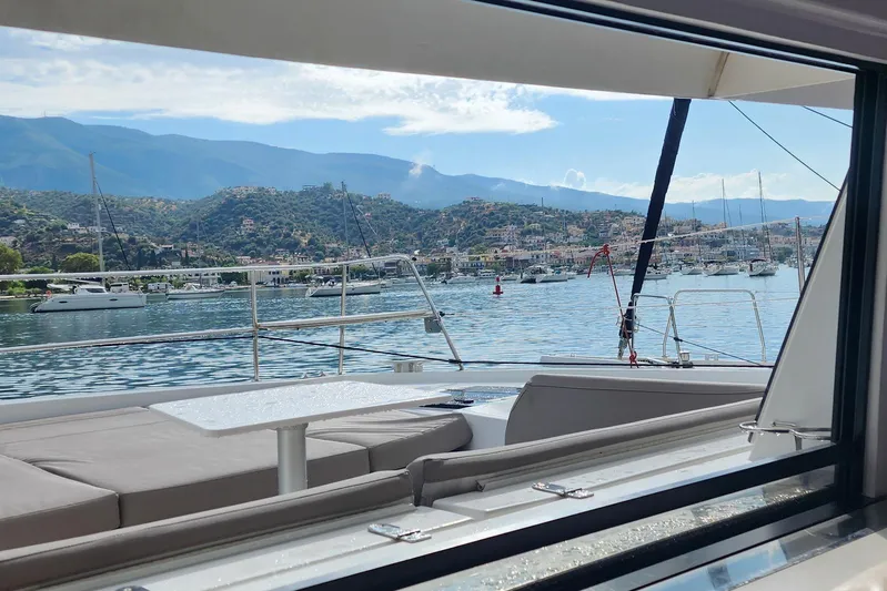  Yacht Photos Pics View from a 2016 Bali 4.5 catamaran overlooking a scenic harbor with mountains.