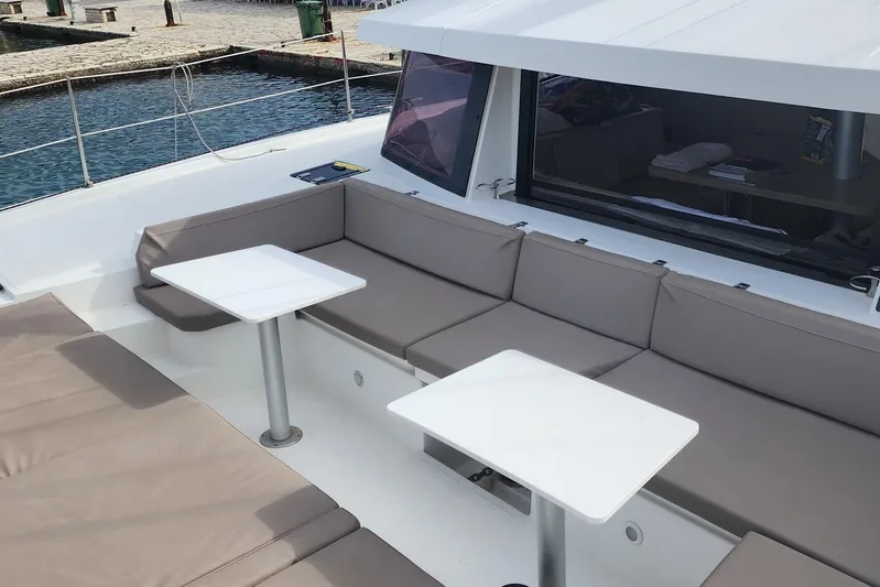  Yacht Photos Pics Luxurious seating area on a 2016 Bali 4.5 catamaran, featuring comfortable cushions and tables.