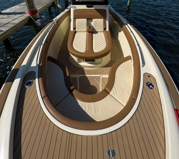 Rest Assured Yacht Photos Pics 2019 Chris-Craft 30 Catalina boat interior with elegant tan seating and wood finish.